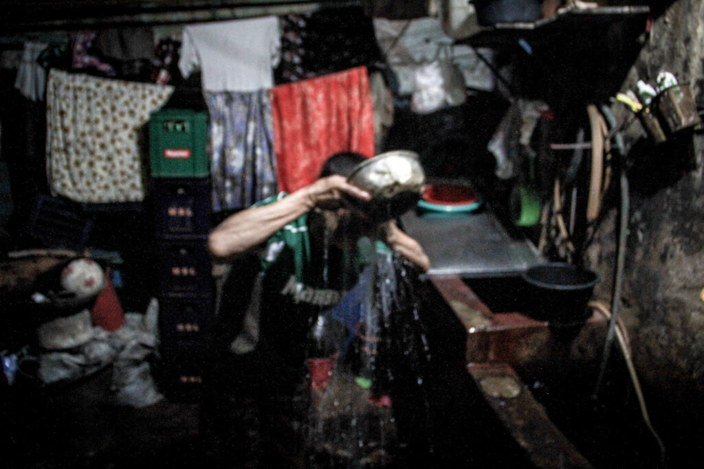 They live in a ground-floor apartment building that was built during the British colonial era in Chinatown, Yangon.