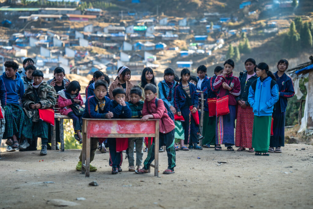 Children are seen at a makeshift school inside the Hpare IDP Camp.