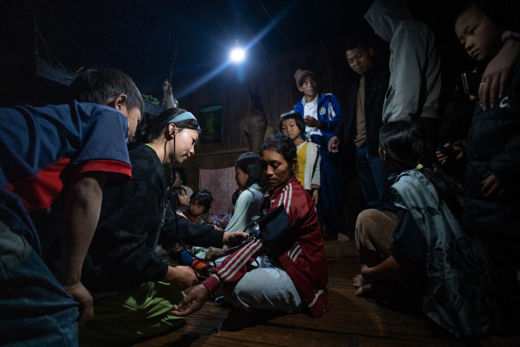 Villagers from the Wor ethnic group gather to receive healthcare services at a remote village in the Hpimaw Township area, along the Kachin-China border, on 22 February 2026.