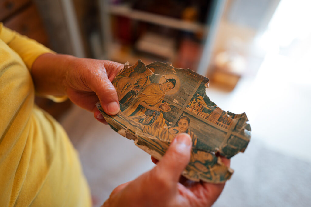 A printed illustration of Buddha that she has kept since medical school in the 1980s. She valued it so much that she carried it with her to the States after the 88 Uprising.