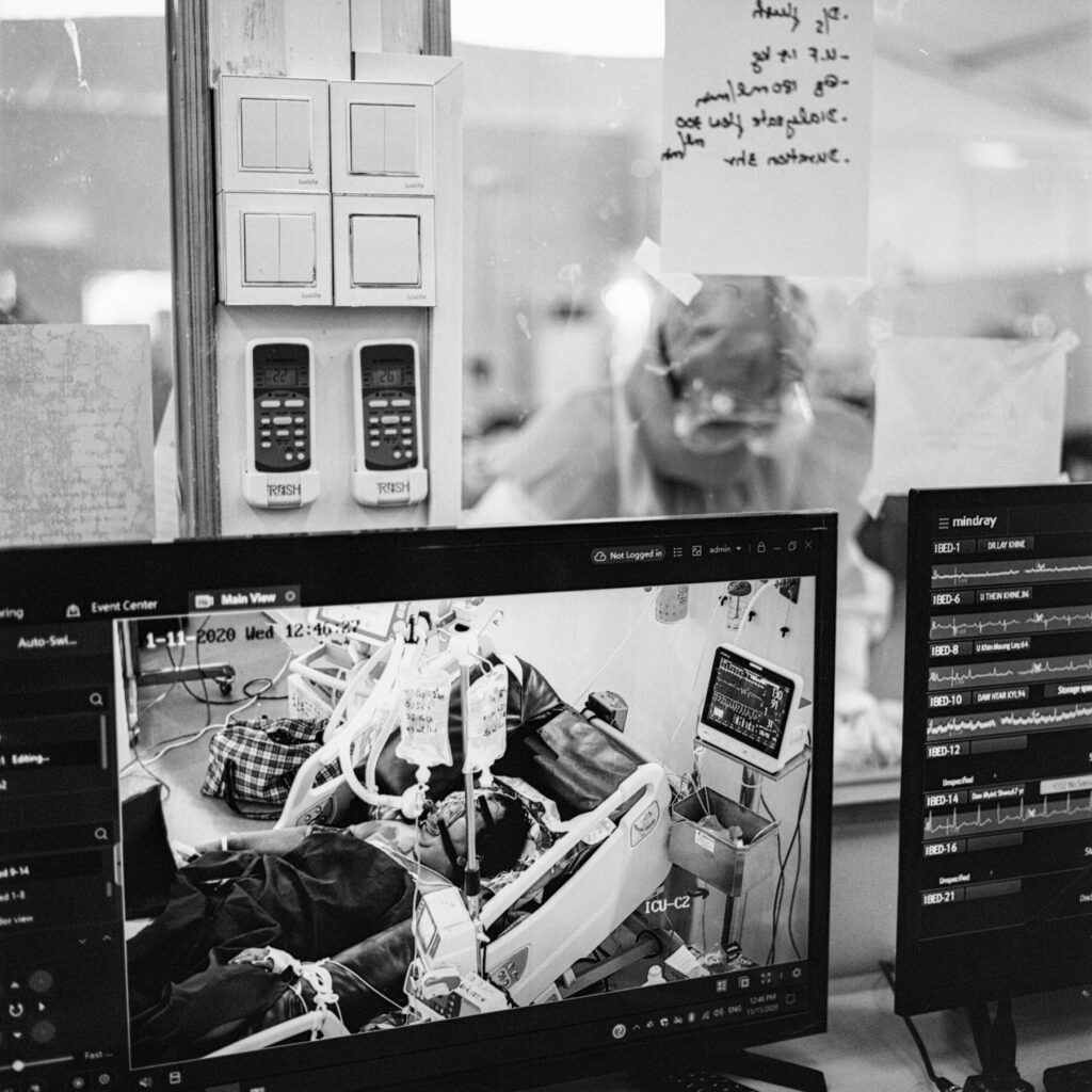 A COVID-19 patient is seen inside Intensive Care Unit (ICU) room at AYA Center in Yangon on 12 November 2020.