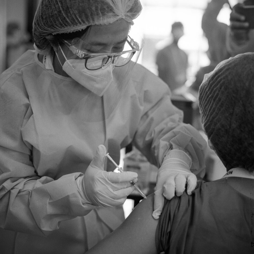 A medical worker injects Covishield, Covid-19 vaccine into a voluntter at the AYA Covid-19 treatment center in Yangon on 25 January 2021.
