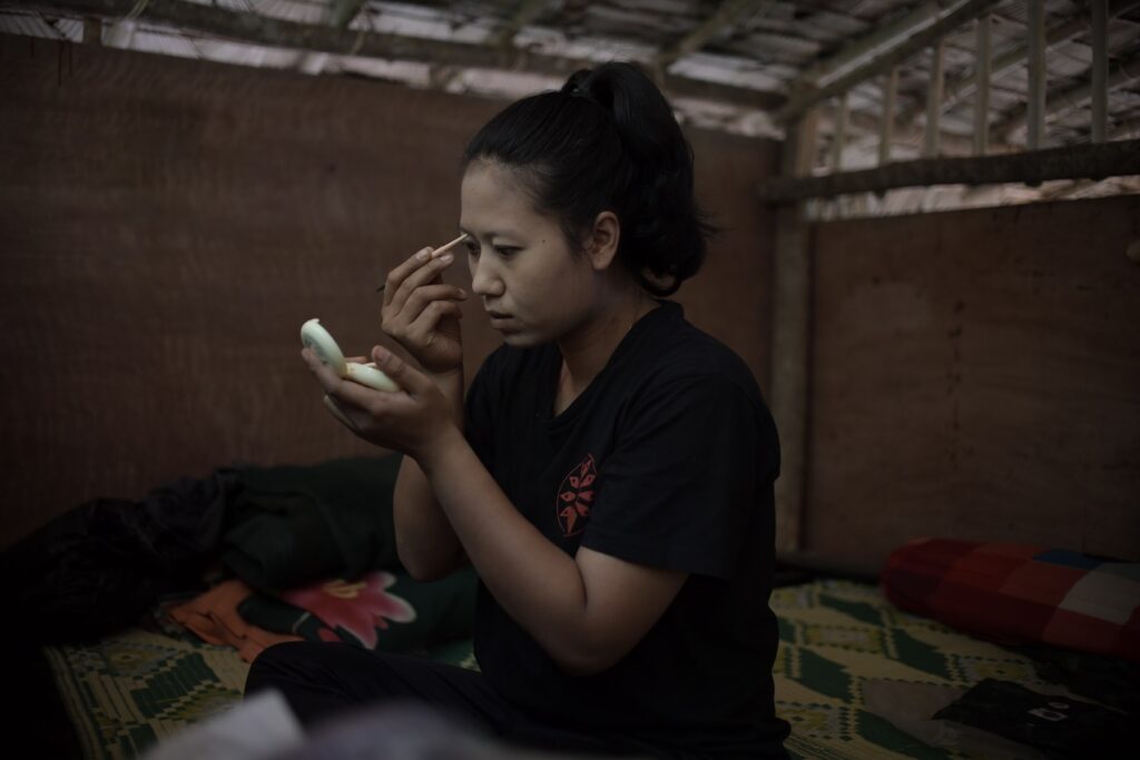 Ma Chel, a 26-years-old public relation officer of Bamar People’s Liberation Army (BPLA) gets ready at her office in a territory of The Karen National Union (KNU), Karen State, Myanmar, March 13, 2024.

